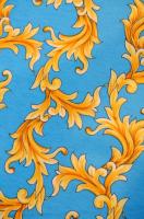 Трикотаж  ЗОЛОТЫЕ ЗАВИТКИ на голубом фоне